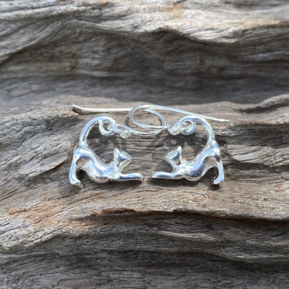 stretching cat earrings